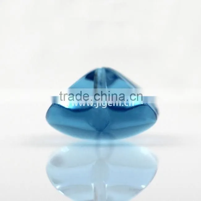 Synthetic glass gem stone with four leaf clover stone