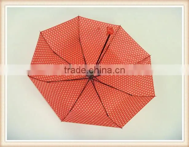 Red fold umbrella with white flower handle color match the fabric