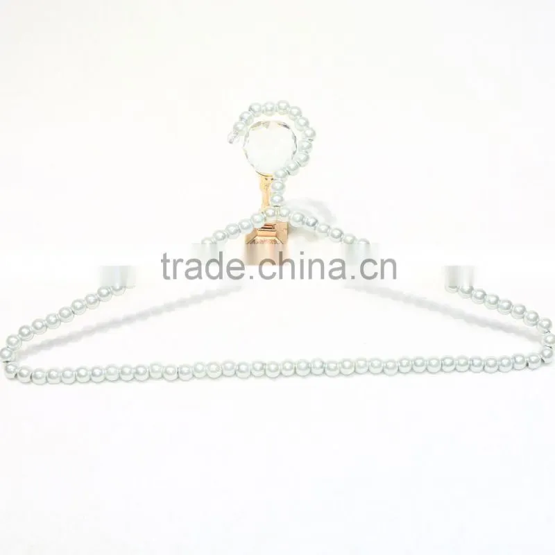 New design cheap brass pearl clothes hanger