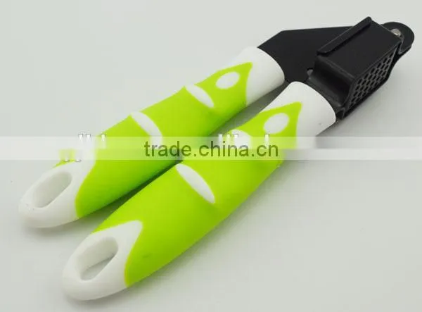 easy to use and clean stainless steel garlic press with soft handle