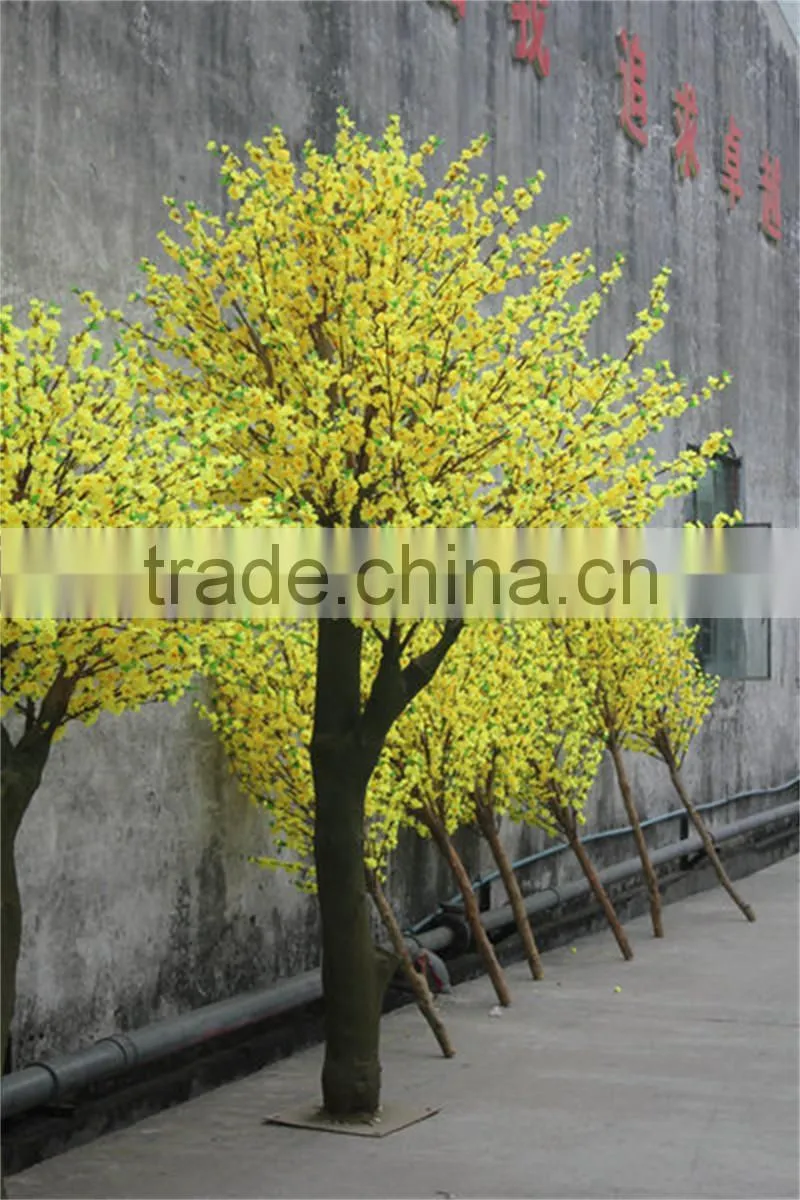 Yellow silk cherry blossom tree with artificial flower