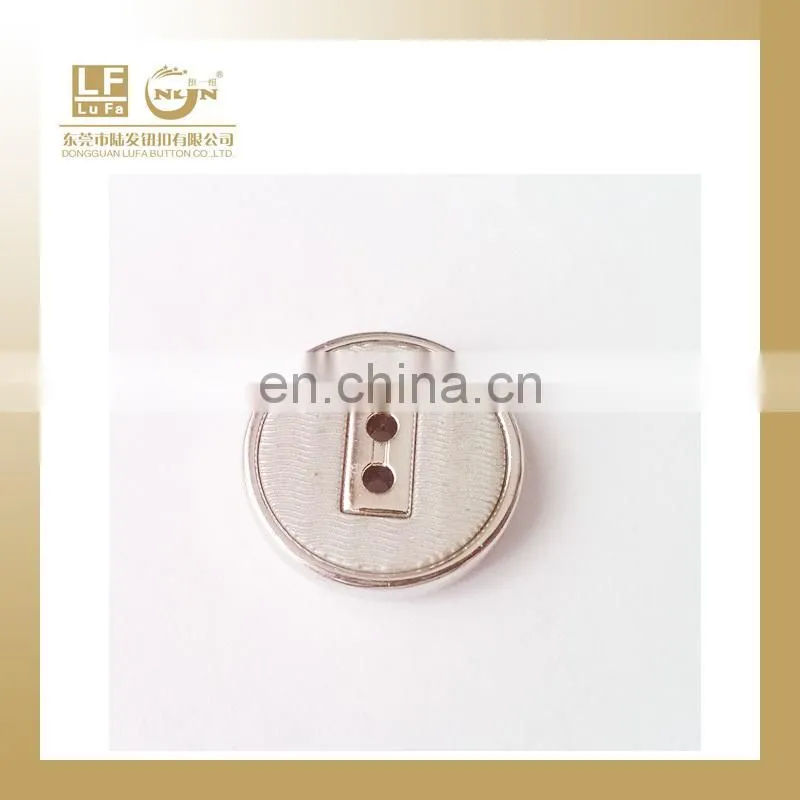 plastic button with metal rim