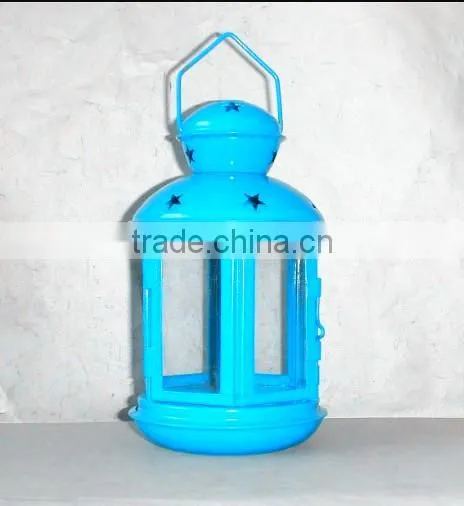 green metal lantern with clear glass wall