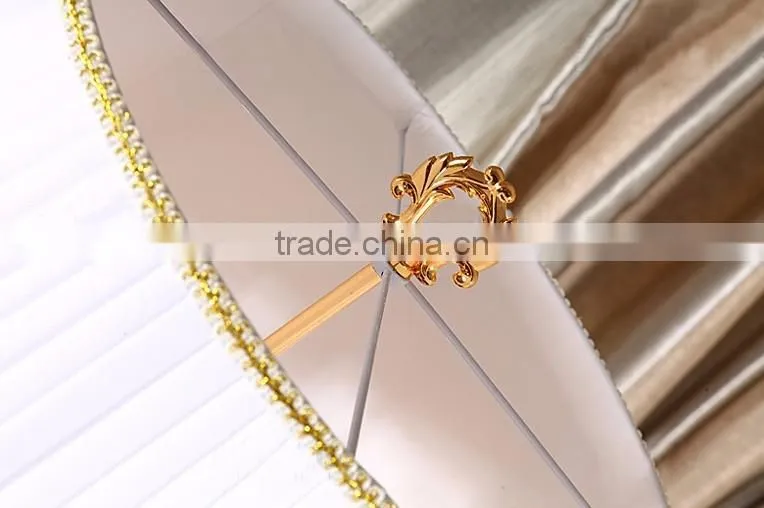 Golden plated metal clear K9 crystal floor lamp with white fabric lampshade