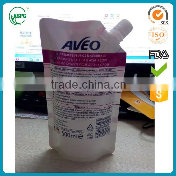 Stand up liquid packaging pouch with corner spout