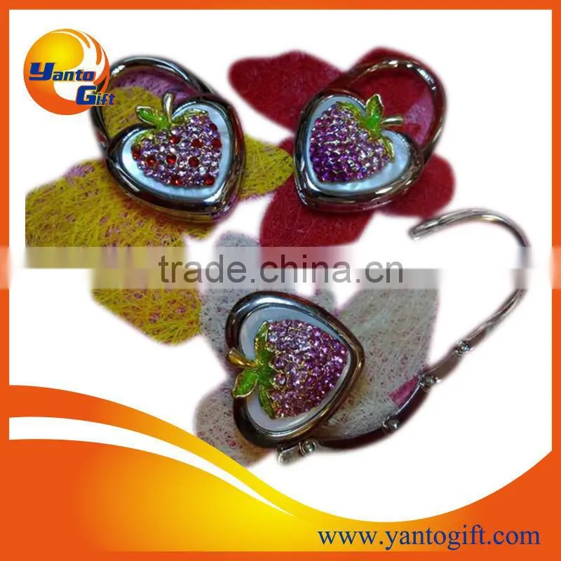 Foldable metal bag hanger