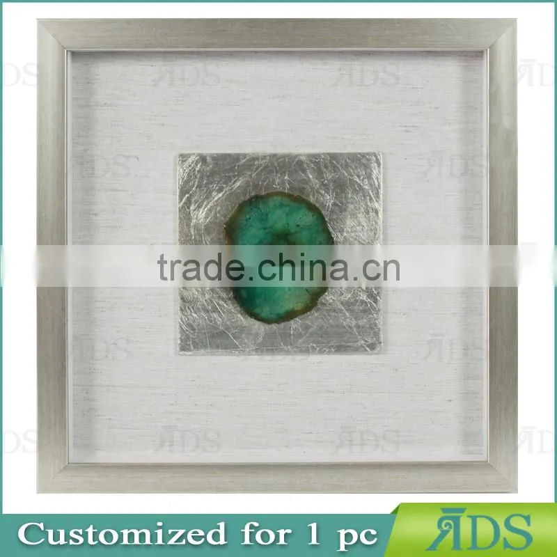 Box photo frames with mottled silver background encasing natural agate under glass