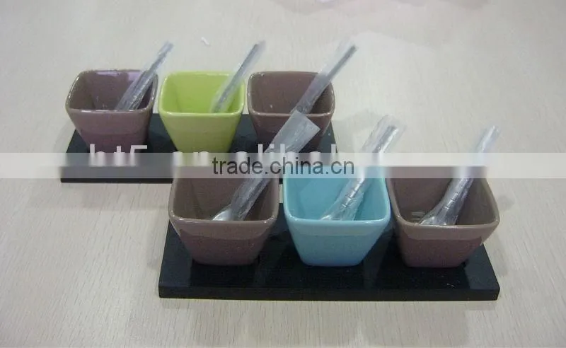Colorful wooden snack tray with ceramic bowl and stainless steel spoon