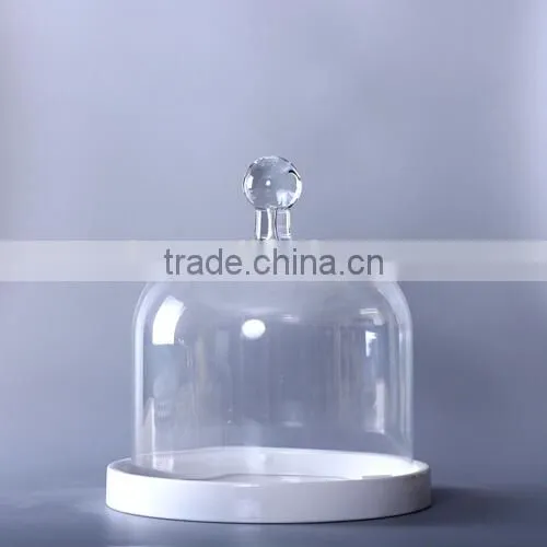 glass display dome with white base