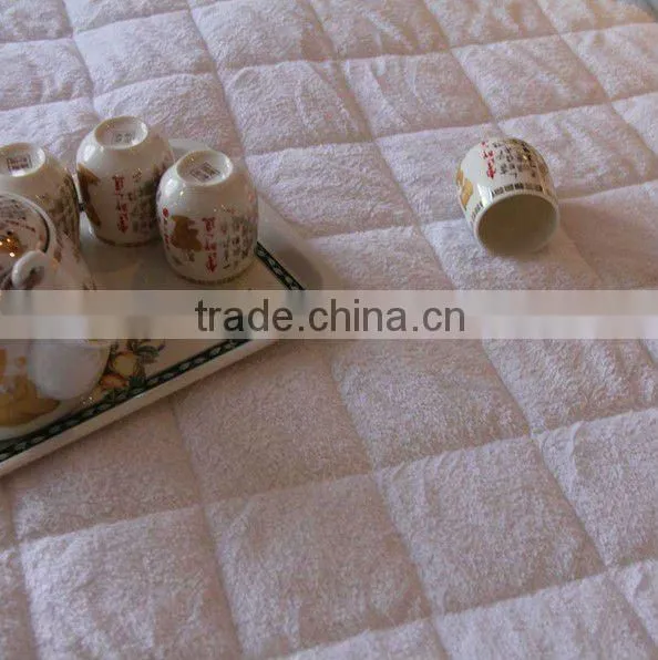 Quilted terry mattress protector for hospitality