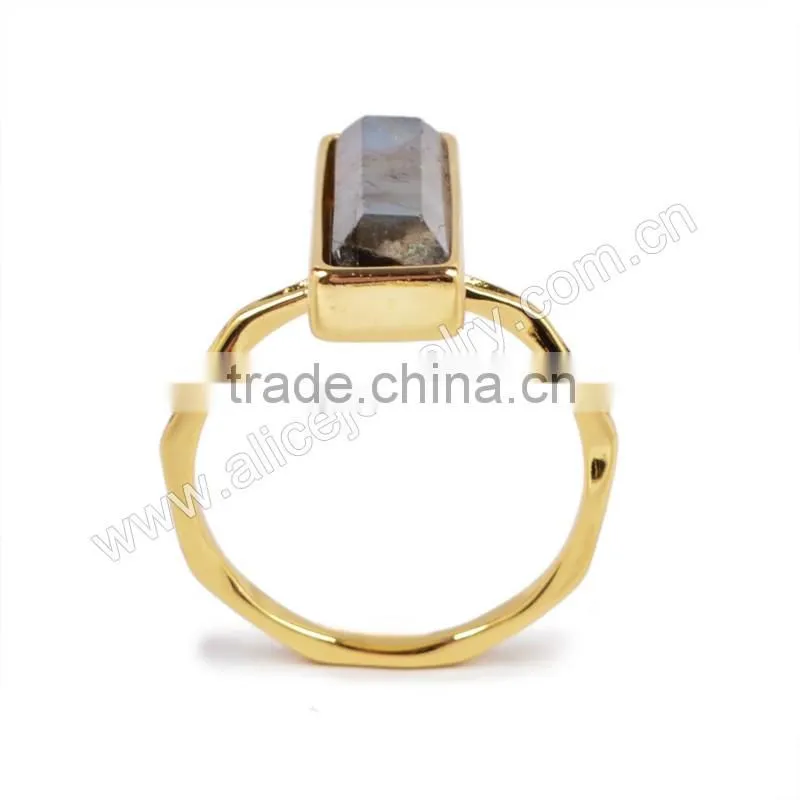 Natural faceted rectangle labradorite gemstone set into a 18k gold bezel ring
