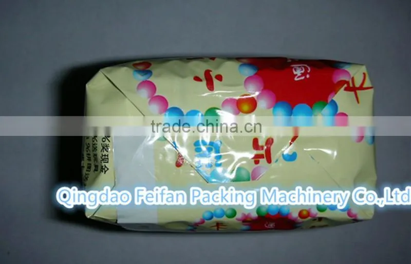 Envelope type biscuit wrapping machine