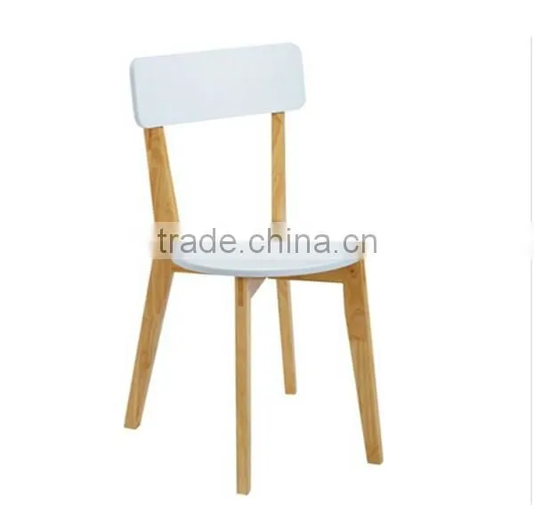 white solid wooden round dining table