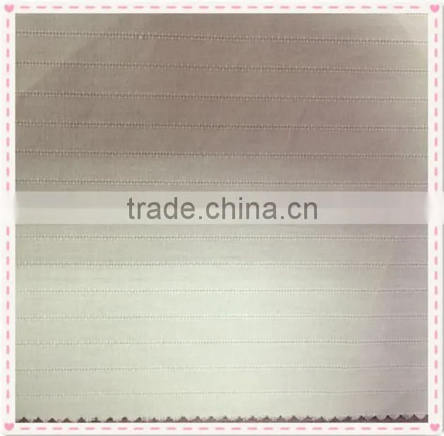 Strip of organic cotton yarn dyed woven fabric