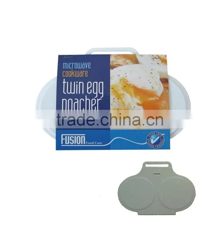 A HANDY TWIN EGG POACHER W/HINGED LID IN MICROWAVE OVEN