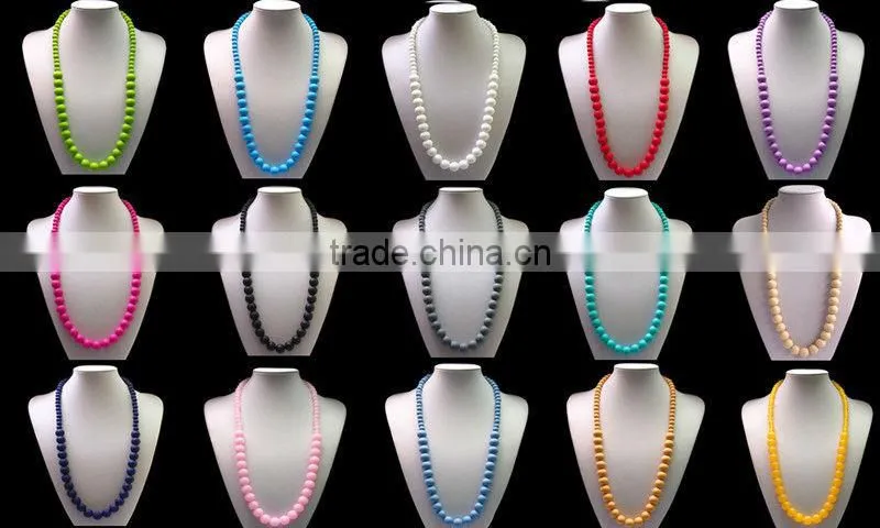 Turqoise silicone teething necklace for mom to wear and baby to enjoy