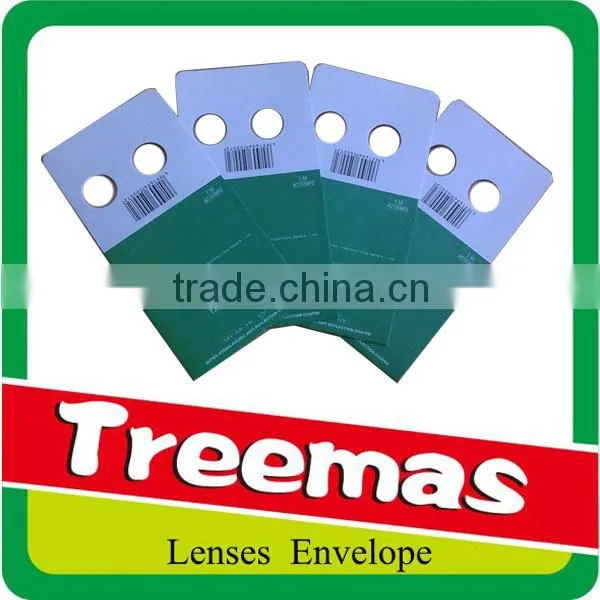 Lenticular aspherical padded envelope optical lens package with holes