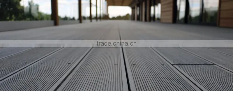 Wood plastic composite outdoor decking flooring with weather resistance features