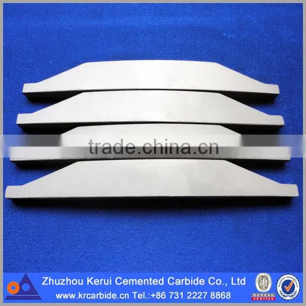 Tungsten carbide components in rotor tips for VSI crusher