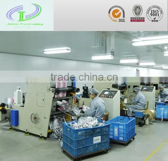 Punching and embossing machine for lids