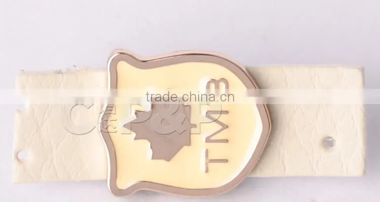 Patent maple leaf leather logo for high end bags