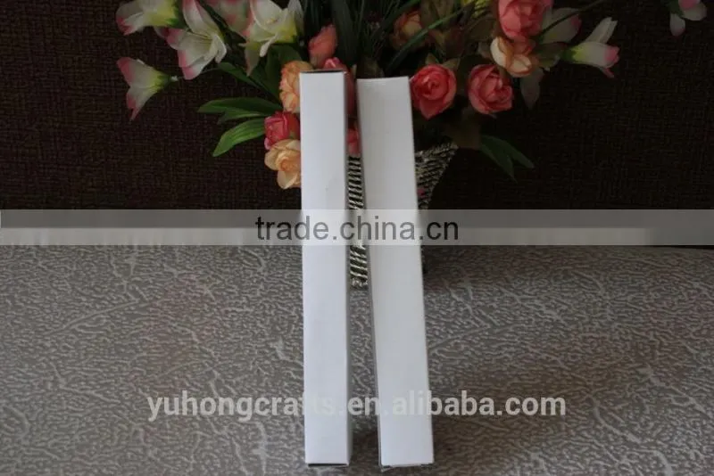 White paper box used for holding ladies fan