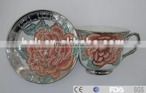 colored cafe tea cup and saucer