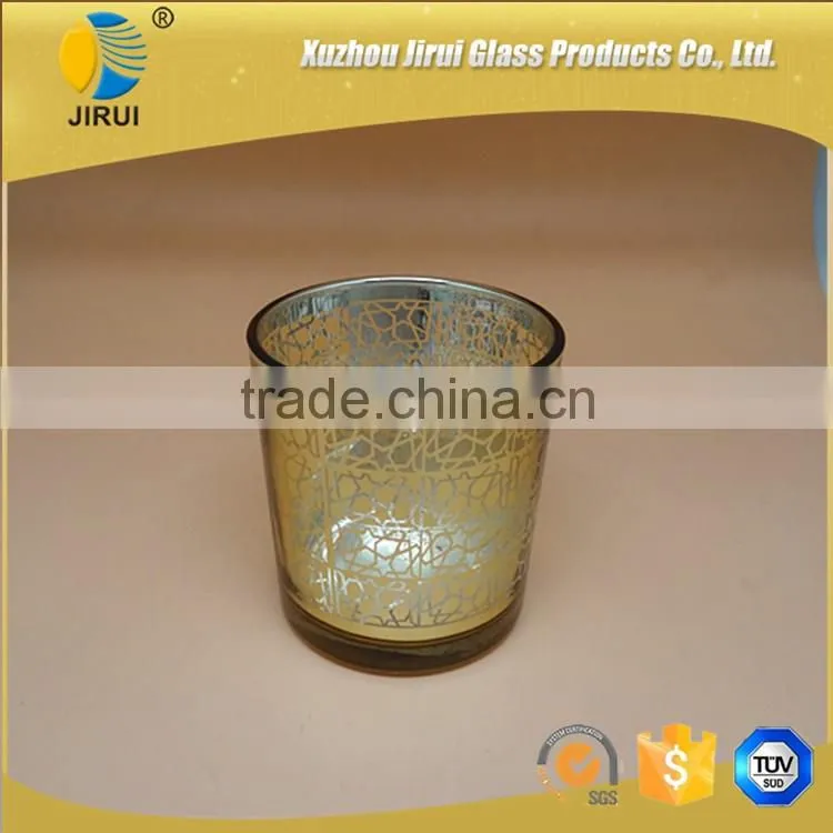 gold glass candle holder with unique pattern