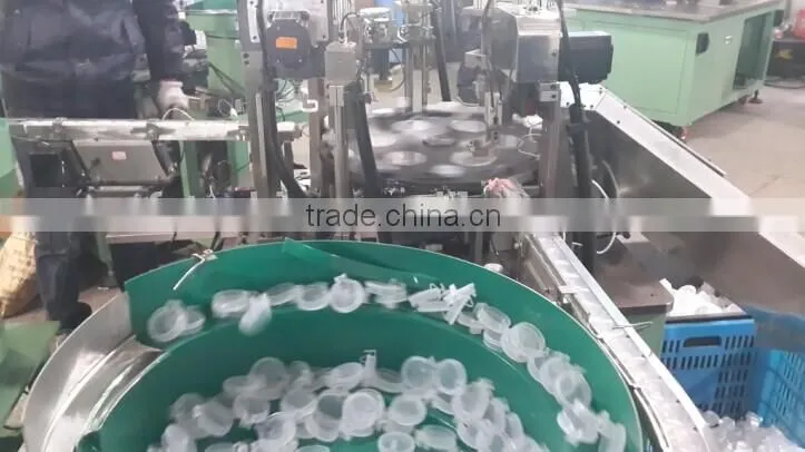 Automatic plastic cap assembly manufacturing machine