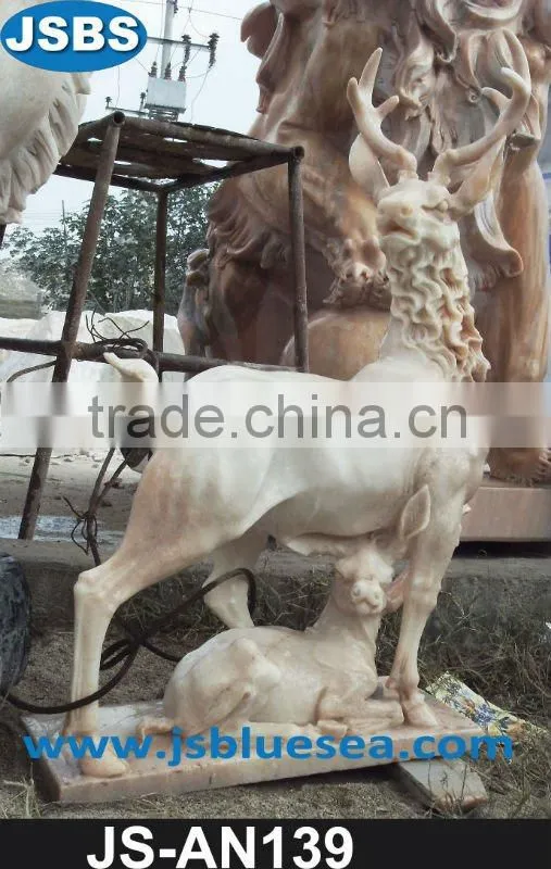 Black marble cow and cowherd statue