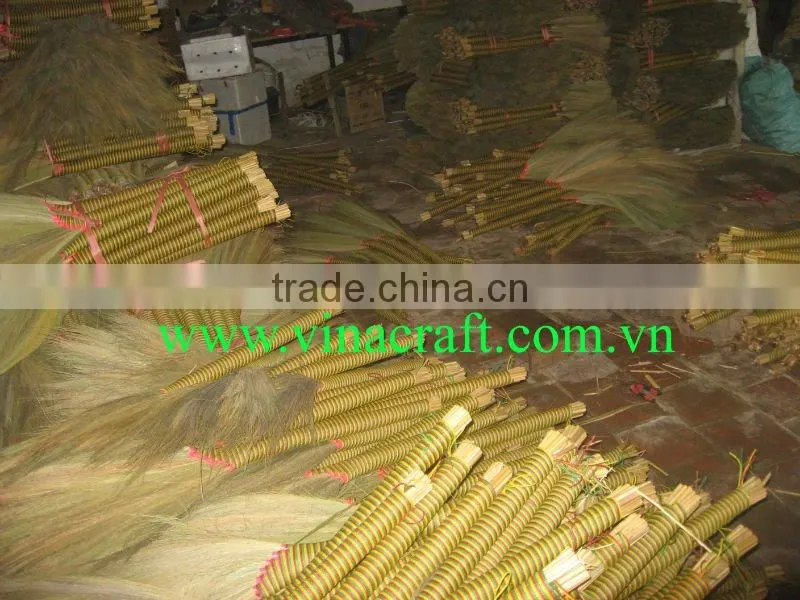 Small grass broom with plastic twist on handle
