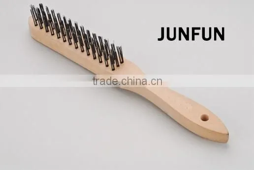 different rows wooden handle black steel wire brush