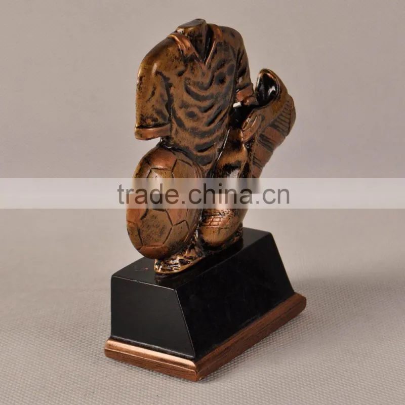 T-shirt football and shoes with sports trophy sculpture