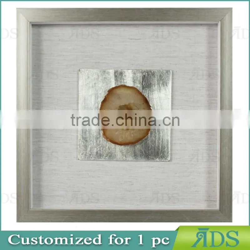 Box photo frames with mottled silver background encasing natural agate under glass