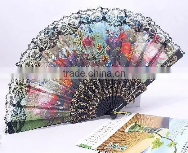 Spanish style plastic folding fan with flower