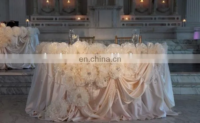 China Supplier Pink Rosette Table Skirting Designs for Wedding