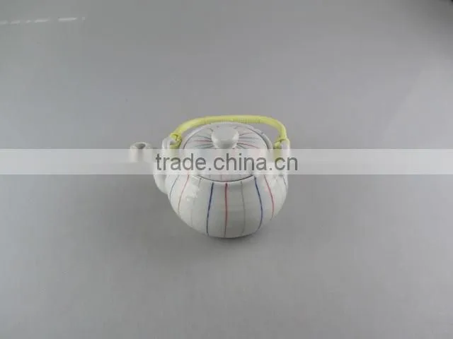 Stocked round ceramic tea pot with flexible handle