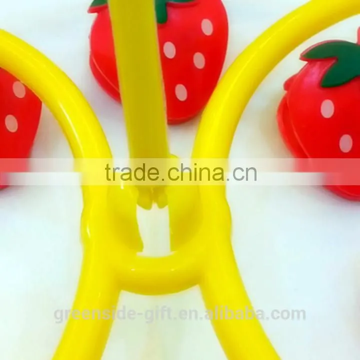 Durable plastic sock hanger with cartoon strawberry pegs