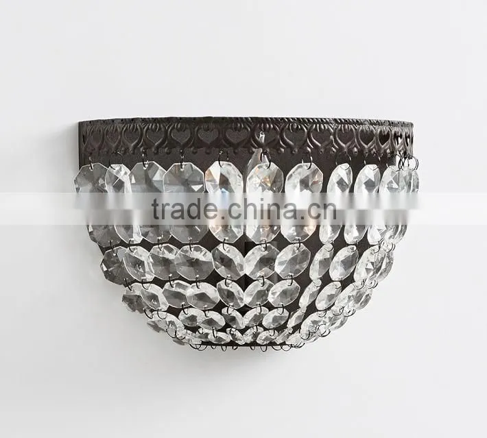 0108-6 antique bronze base is embellished with decorative detailing Cascading faceted glass crystals sparkle sconce