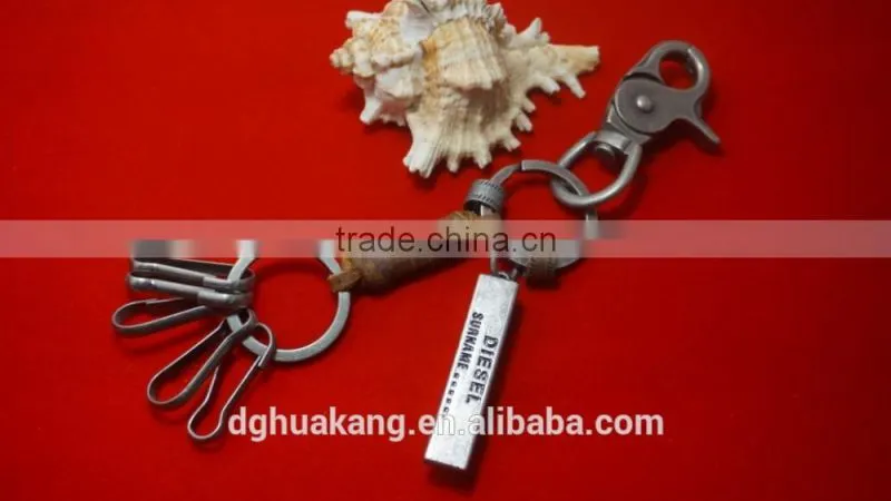 Antique silver alloy keychain with coiled real leather cord and beer bottle opener