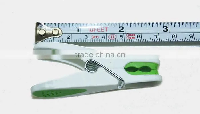 packed into plastic basket new material hanging colored peg for clothes