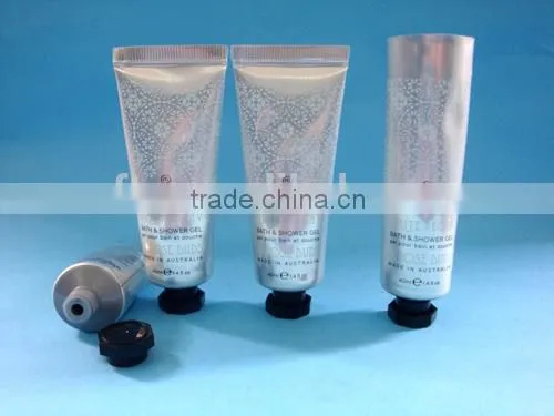 Cosmetic tube with silicone valve flip top