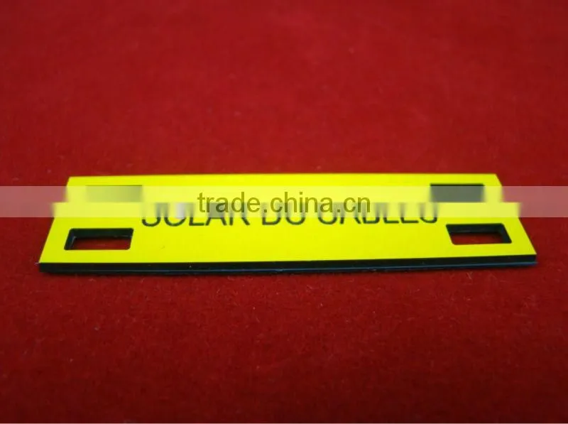 Self adhesive ABS tag with holes