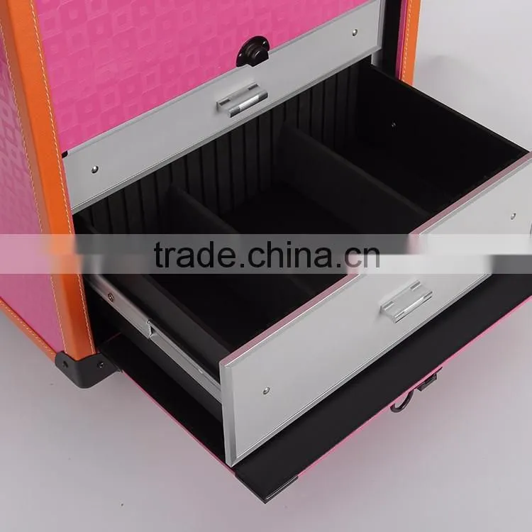 Pink rolling makeup case with trays