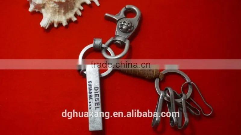 Antique silver alloy keychain with coiled real leather cord and beer bottle opener