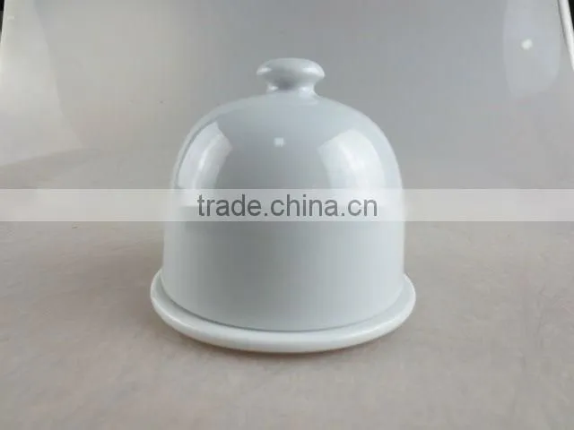 white porcelain bell-shaped butter dish with lid