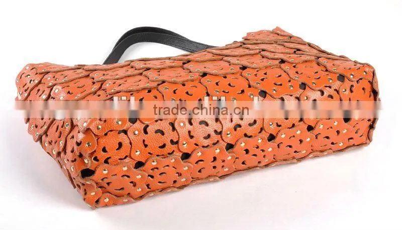 2012 fashion leather handbag ladies bag with punch flower patterns!