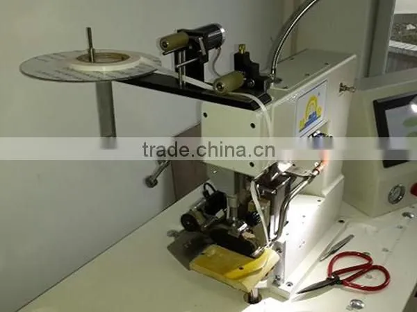 ultrasonic trimming and tape adhesive machine for seamless ankle socks