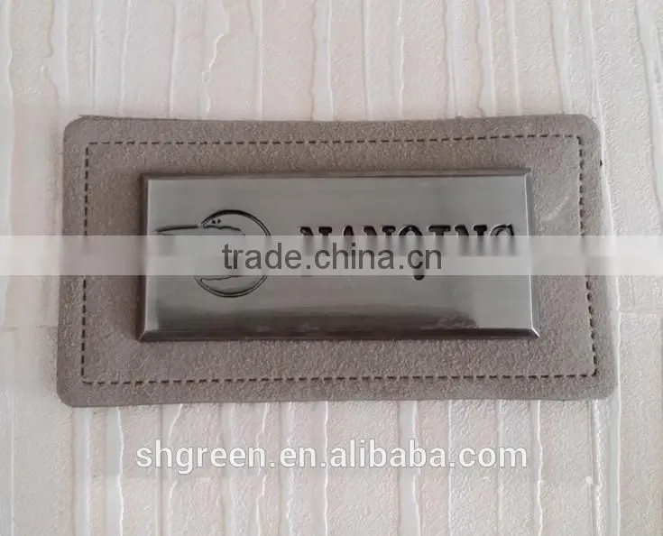 Promotional white real leather label with engraved logo metal plate