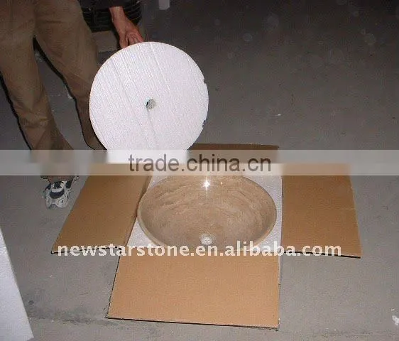 beige round marble bowl